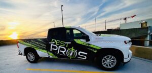 Pest Pros truck with a sunrise in the background.